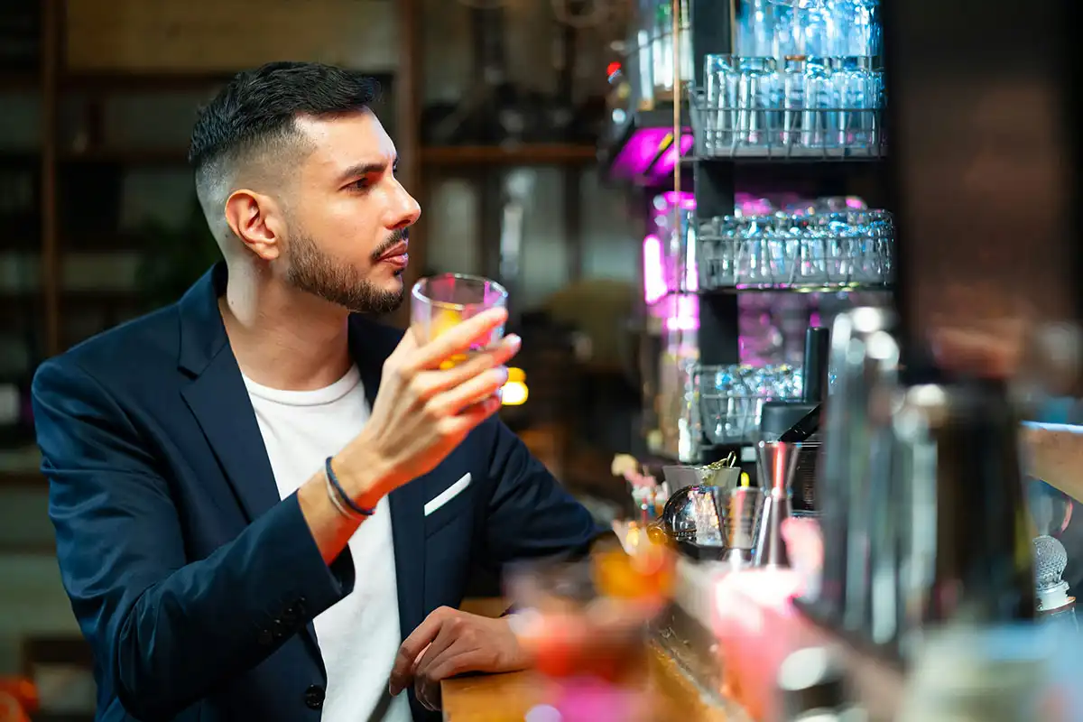 man drinking alcohol